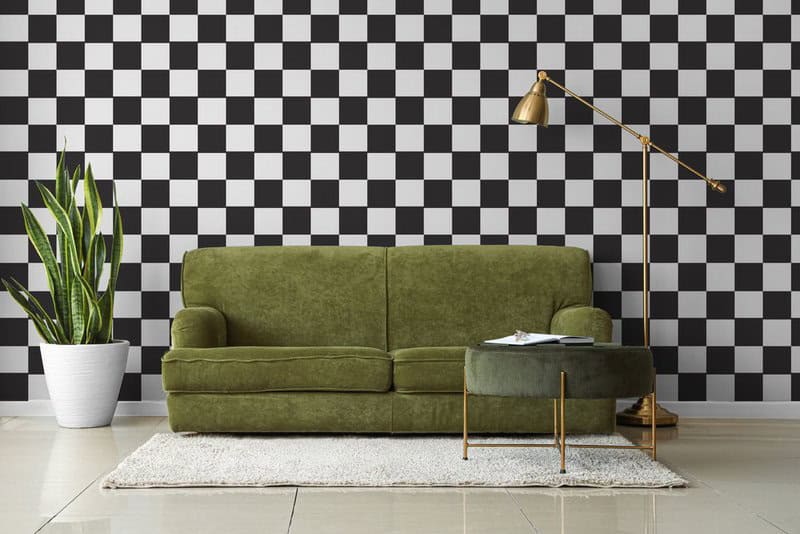 Interior Of Light Living Room With Green Sofa, Pouf And Lamp