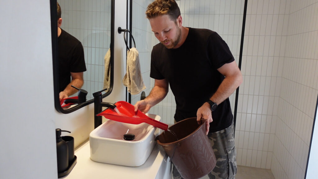 Use A Dustpan To Fill A Bucket