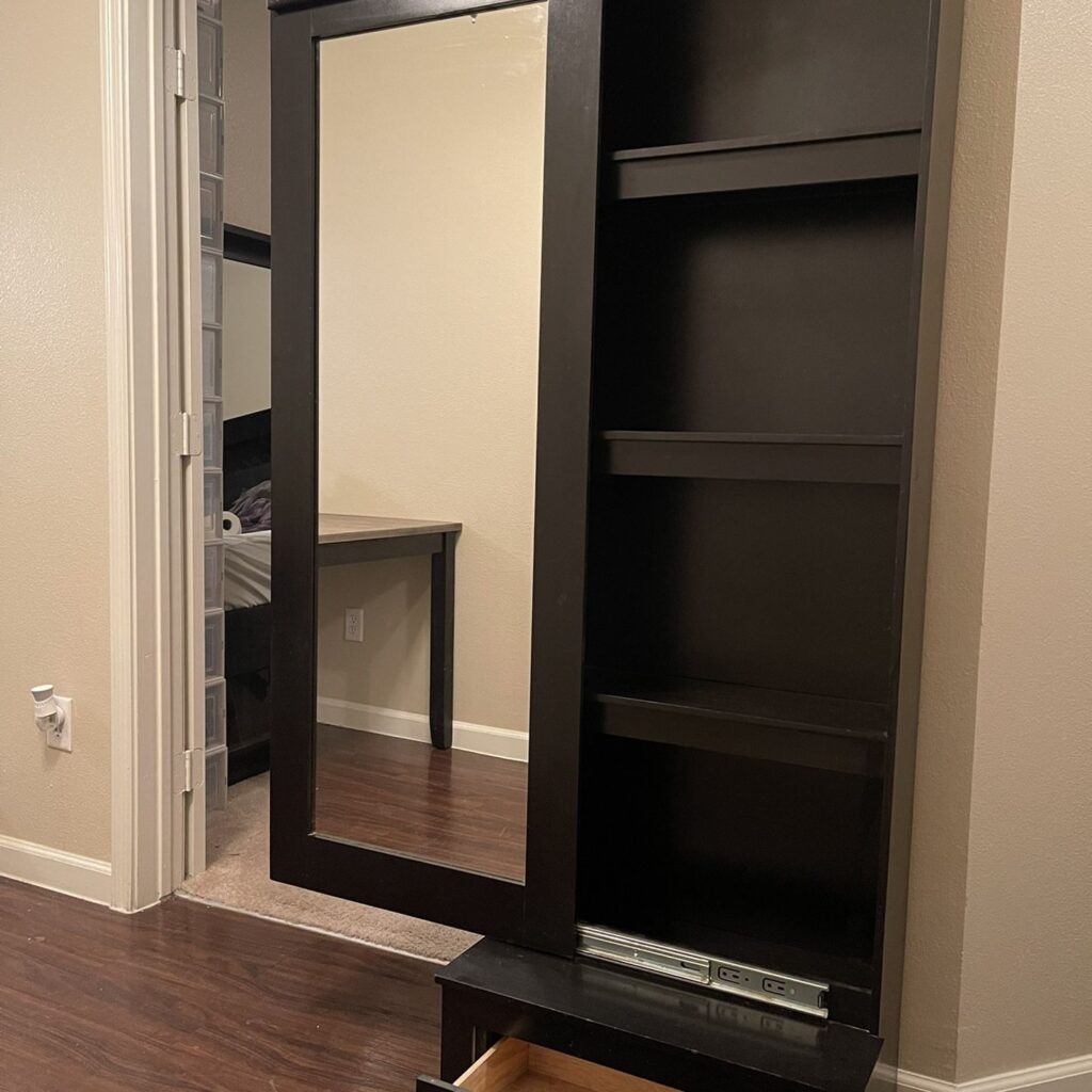 Behind A Large Wall Mirror
