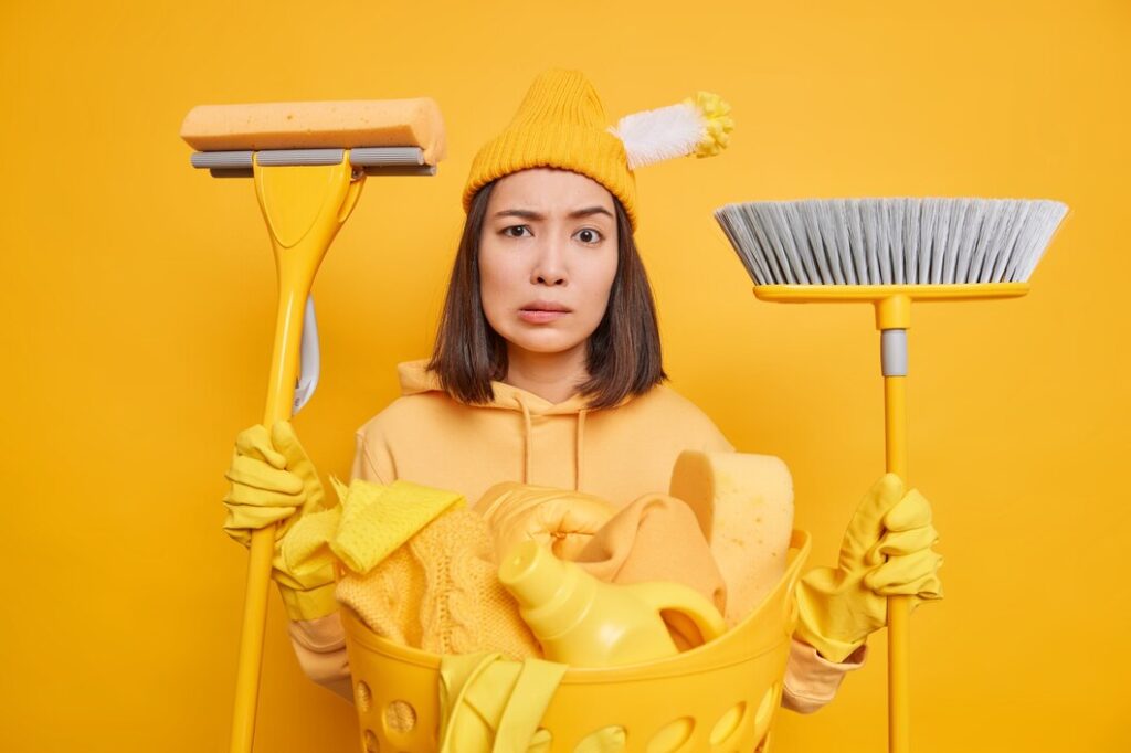 Carrying A New Broom And Mop