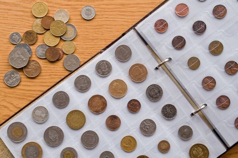 Page Of Numismatics Album With Different Coins