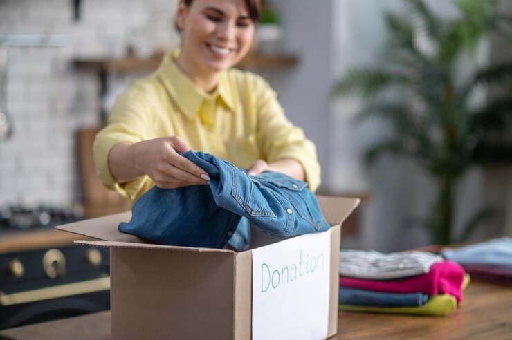 Focused Contented Female Packing Clothes Donation 259150 59379