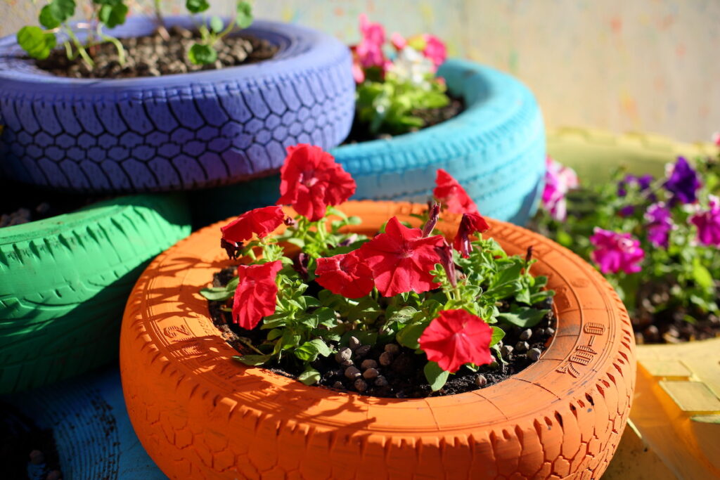 Old Tires (used As Garden Beds And Playground Equipment)