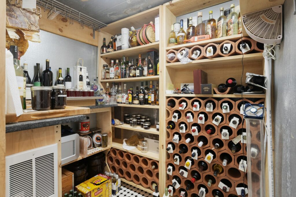 a wine cellar with a lot of bottles on the shelves