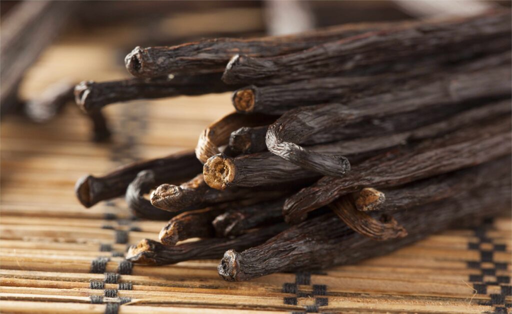 Vanilla Beans Extract Grade B Whole Pods In Jar Close Up Ends Cropped