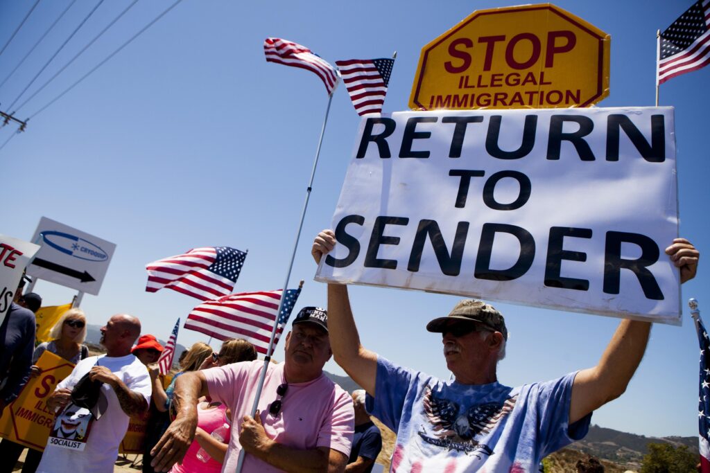 Demonstrators Picket Against The Possible Arrivals Of Undocumented Migrants Who May Be Processed At The Murrieta Border Patrol Station In California