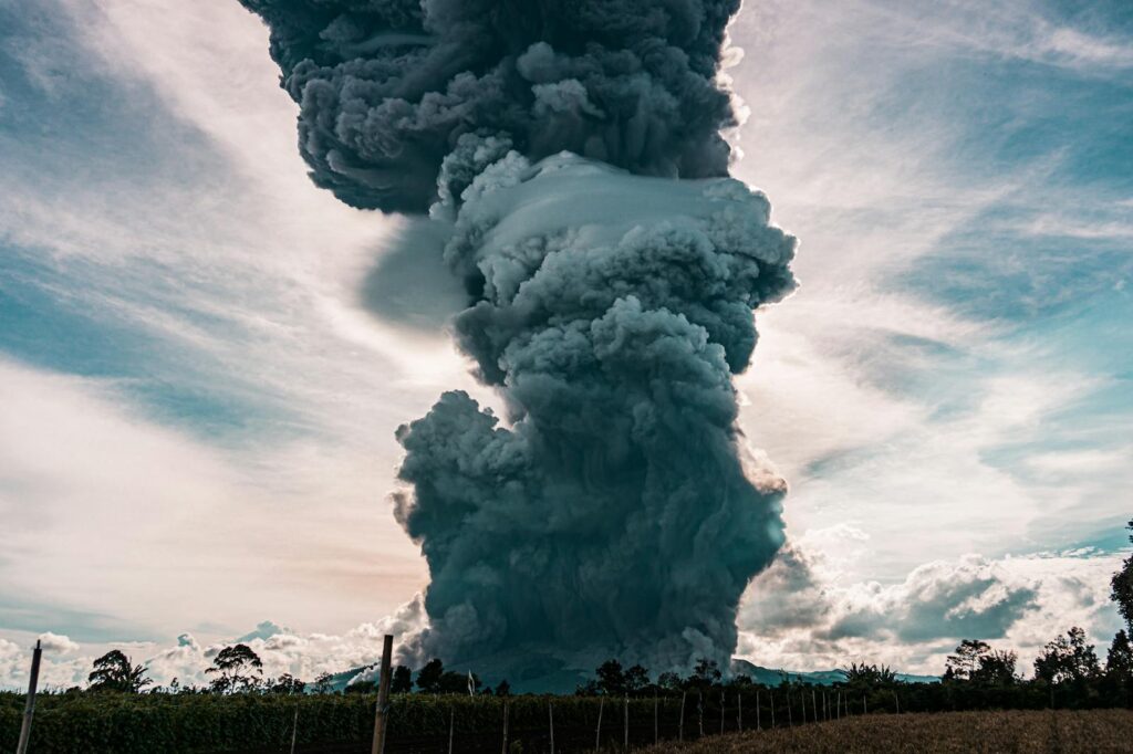 Dramatic eruption of Mount Sinabung in North Sumatra, Indonesia, with massive ash cloud.