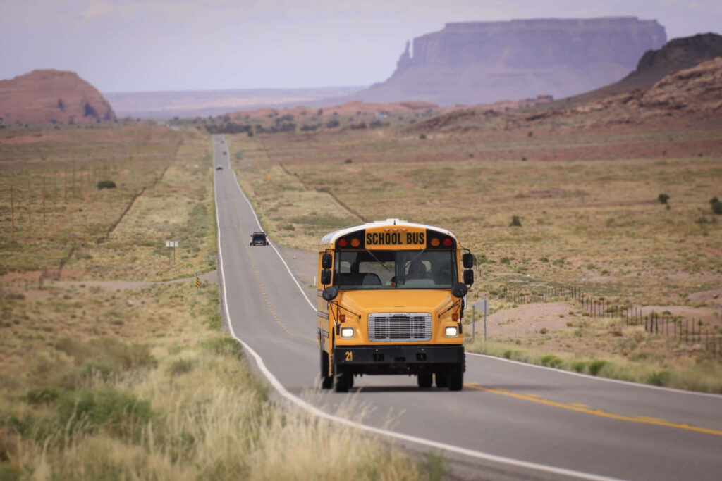 School Bus On Long Rural Road I1syeo0s7l160jqp