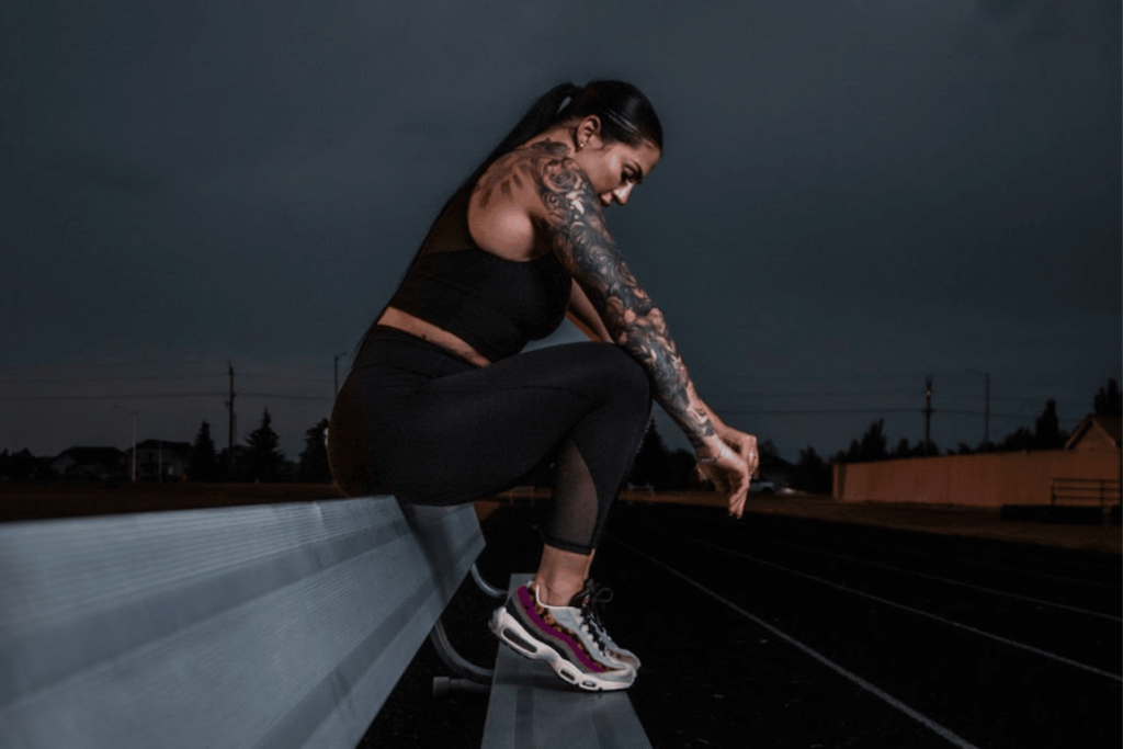 A Young Women Resting During A Nighttime Run