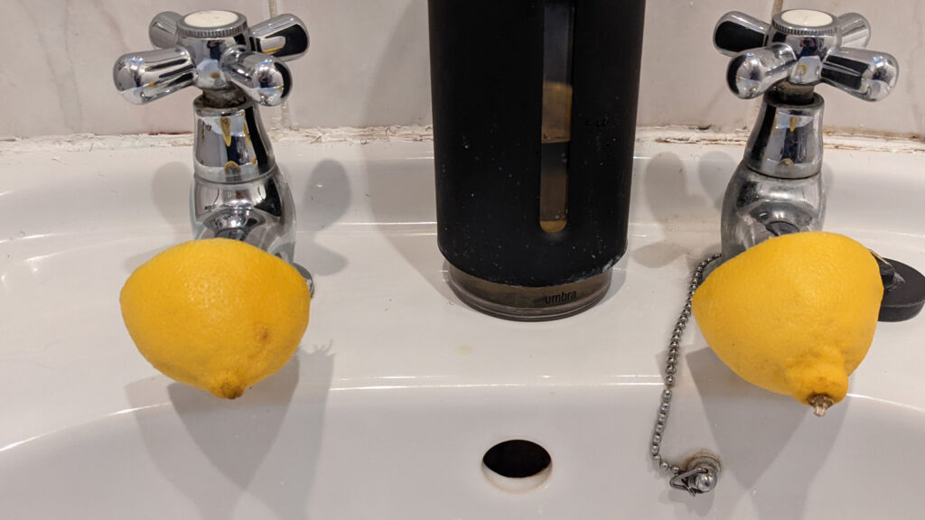Cleaning Faucets With A Lemon Half
