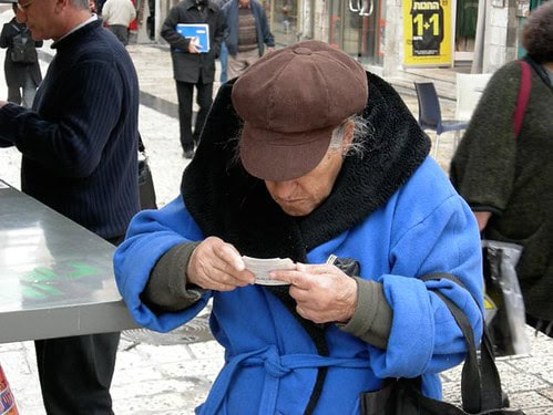 Woman looking at lottery ticket