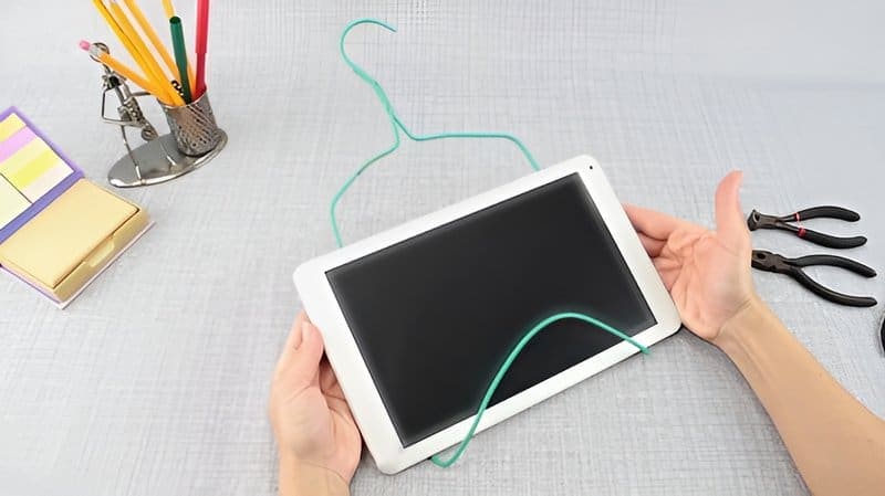 9. Clothes Hanger Tablet Stand