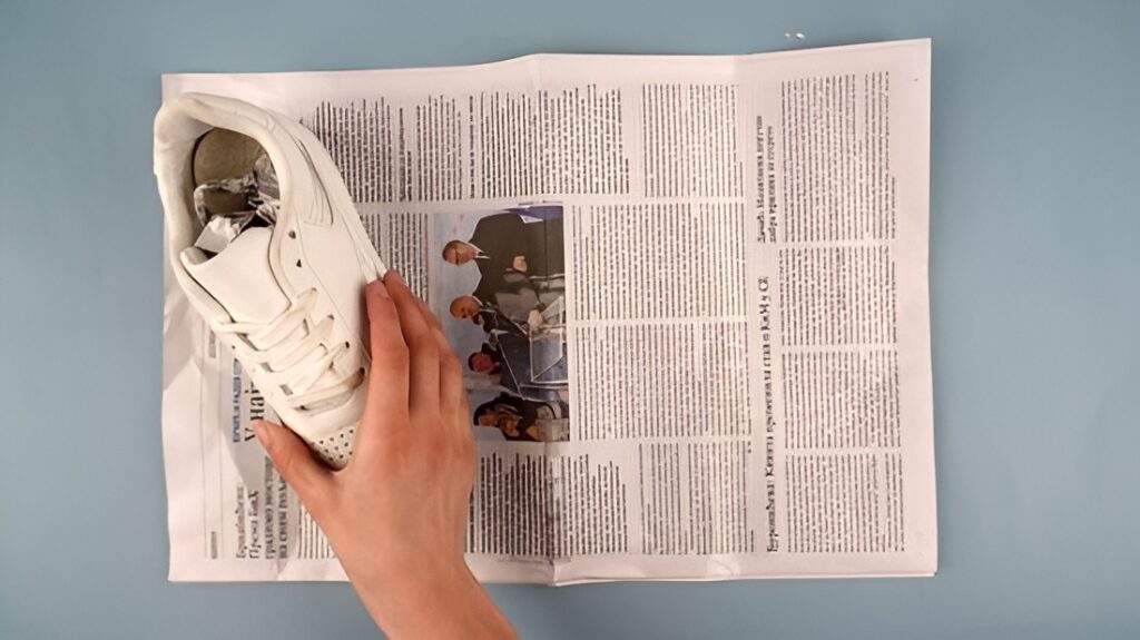 Drying Wet Shoes With Newspaper