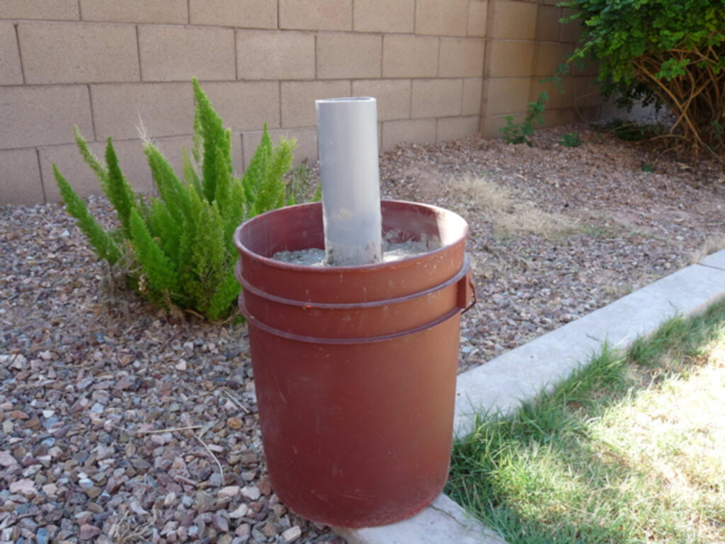 Umbrella Stand From An Old Paint Can And Concrete