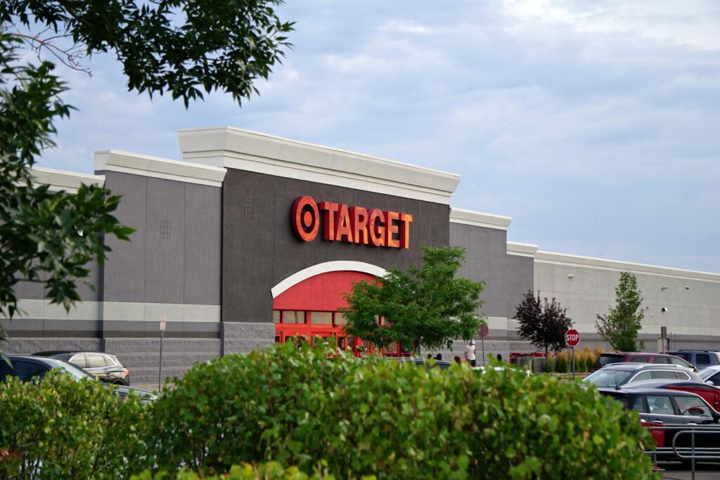 View of a Target store with parking lot, featuring signage and greenery.