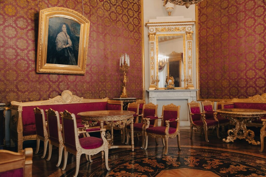 a room with a table, chairs, and a mirror