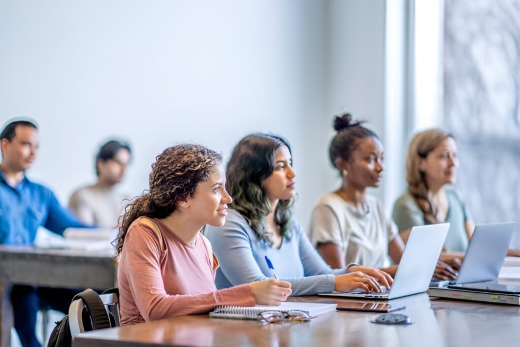 A group of students attentively participates in financial literacy courses