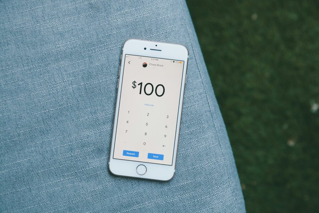 white samsung android smartphone on gray textile