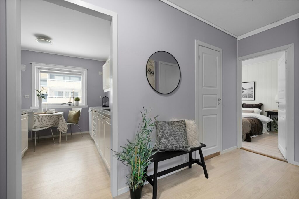 A living room filled with furniture and a mirror