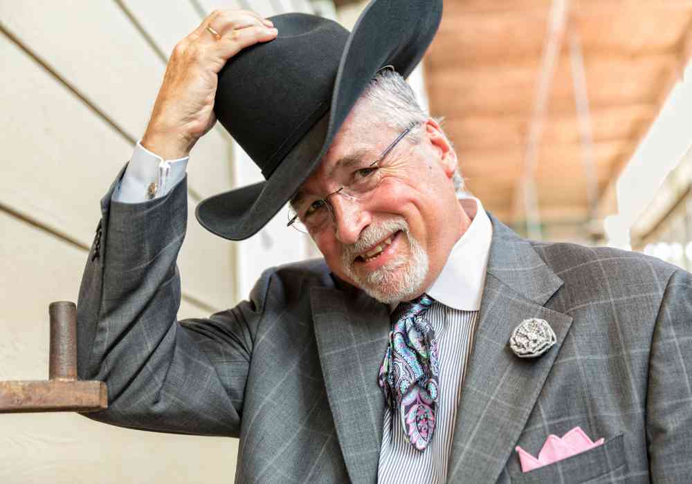 Man tipping cowboy hat