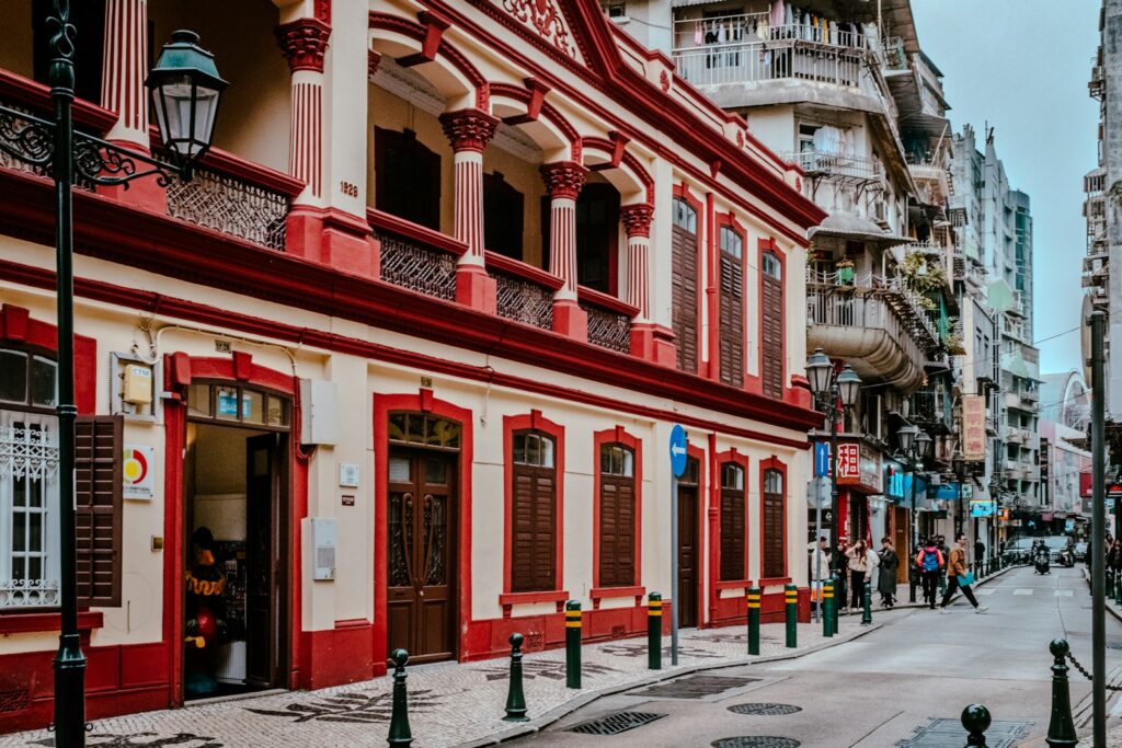 a red and white building on a city street