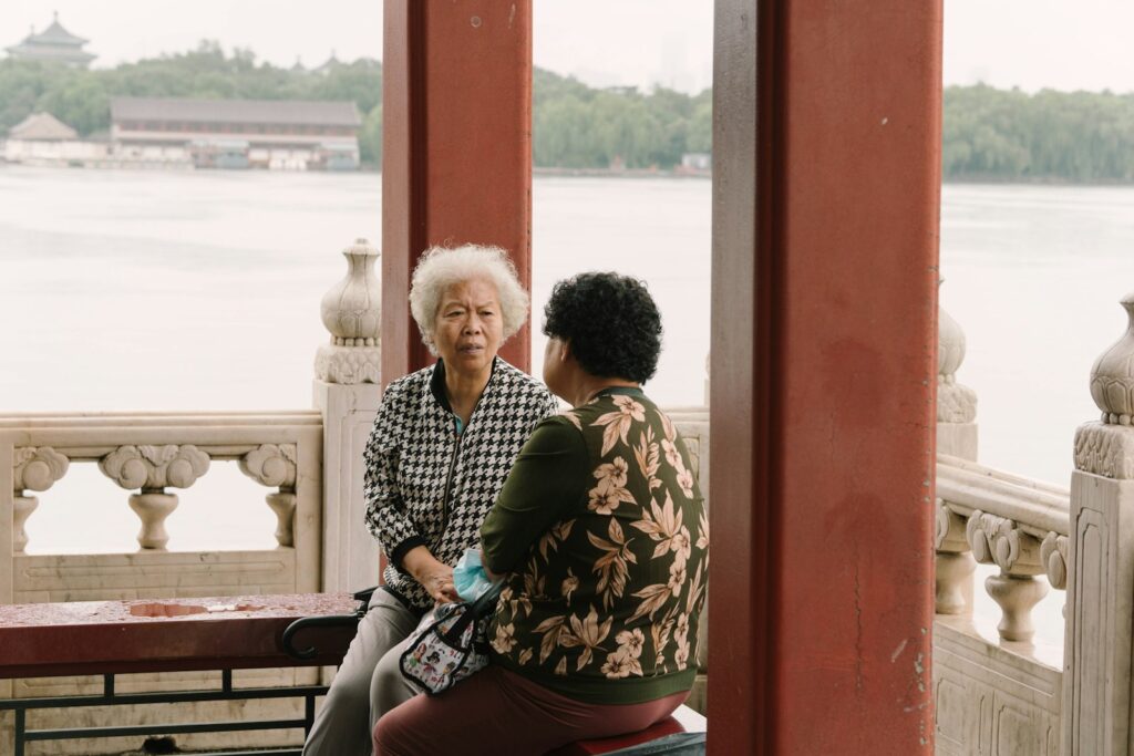 a man and woman sitting on a bench