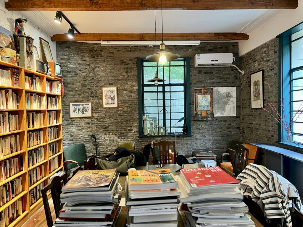 a room with a table and books