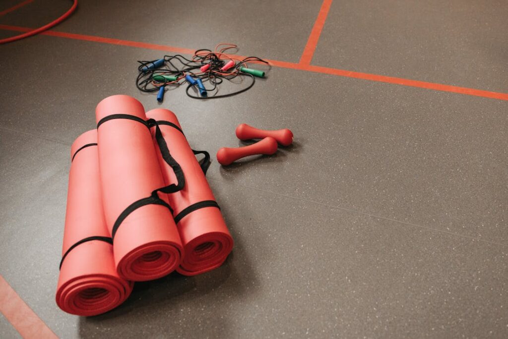 Yoga mat and fitness equipment neatly arranged