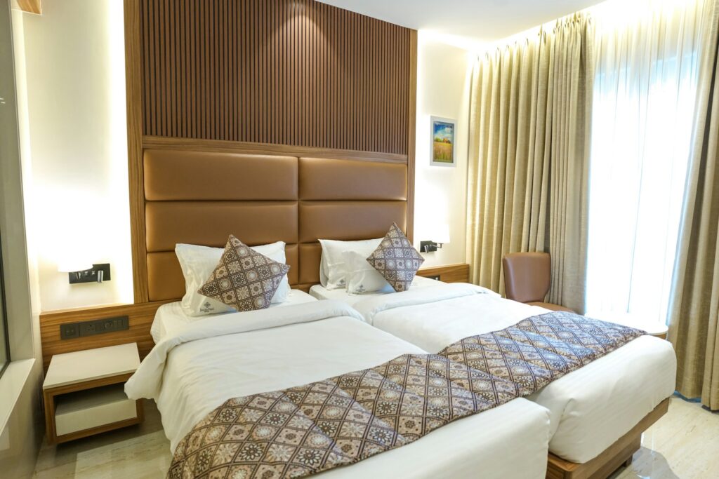 A hotel room with two comfortable twin beds.